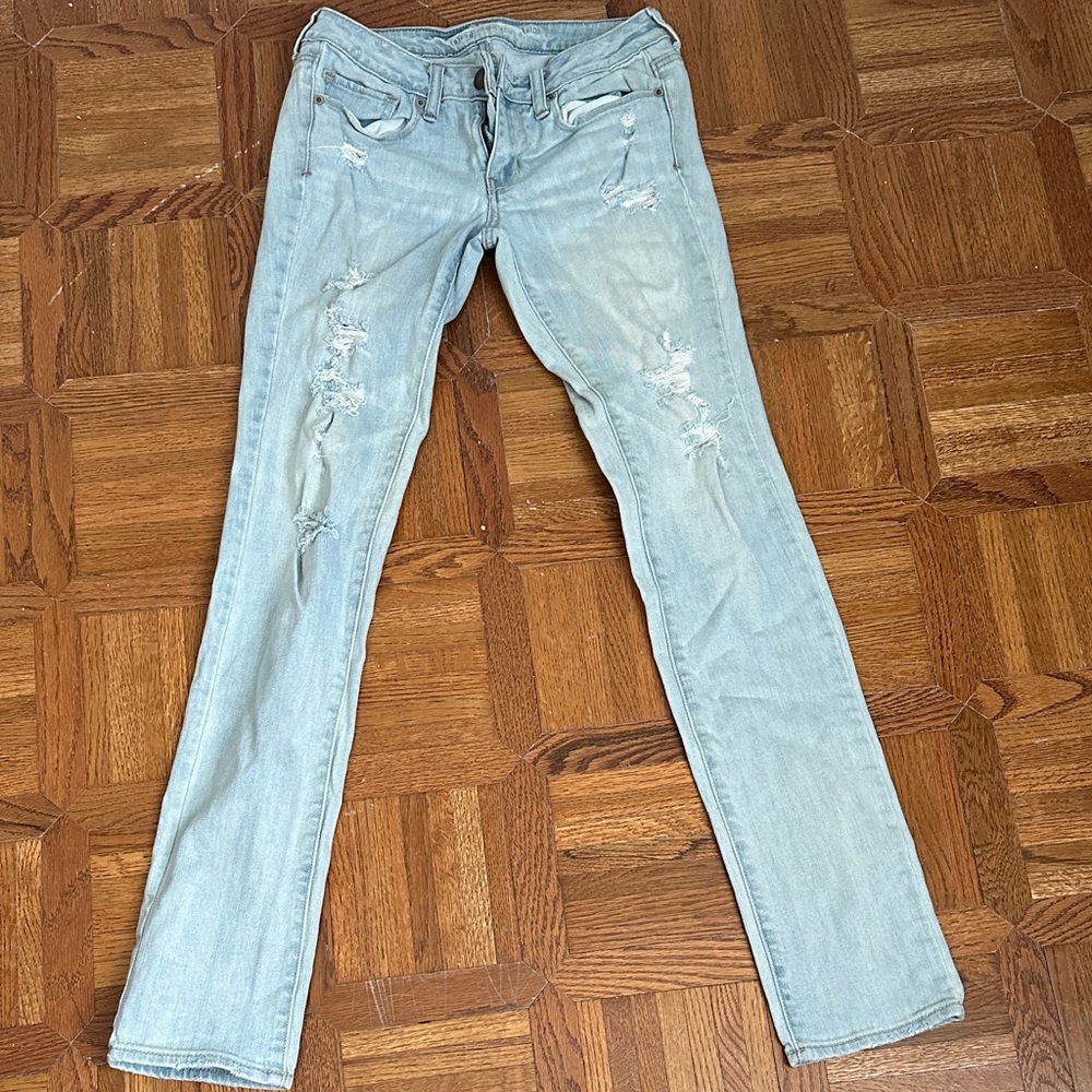 women’s light blue ripped jeans
